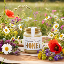 Jar of creamed honey in meadow